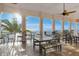 Outdoor seating area with a partial ocean view and ceiling fan at 219 Pompano Se Dr # D, St Petersburg, FL 33705