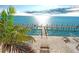 Relaxing waterfront view with a private dock, lounge chairs and patio furniture at 219 Pompano Se Dr # D, St Petersburg, FL 33705