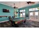 Bright game room features pool table, ceiling fans, and great views at 219 Pompano Se Dr # D, St Petersburg, FL 33705