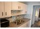 This updated kitchen features stainless appliances, granite countertops, and modern fixtures at 219 Pompano Se Dr # D, St Petersburg, FL 33705