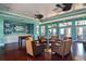 A lounge area with chairs, ceiling fans, foosball table, and outdoor access at 219 Pompano Se Dr # D, St Petersburg, FL 33705