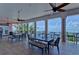 An open-air patio seating area with ocean views and ceiling fans for cooling at 219 Pompano Se Dr # D, St Petersburg, FL 33705