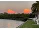 Condos featuring calm water view and colorful sky at 219 Pompano Se Dr # D, St Petersburg, FL 33705