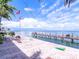 Gorgeous waterfront view, brick patio with furniture, dock and cornhole game at 219 Pompano Se Dr # D, St Petersburg, FL 33705