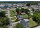 A well-maintained home sits on a lush lot with mature trees at 2306 Cheryl Rd, Largo, FL 33771