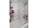 Beautifully remodeled bathroom with a white tub, stylish tile details, and a modern showerhead at 2306 Cheryl Rd, Largo, FL 33771
