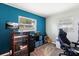 Cozy bedroom with natural light, featuring a desk, personal items, and comfortable living space at 2306 Cheryl Rd, Largo, FL 33771