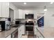Modern kitchen with sleek appliances, ample counter space, and stylish cabinetry for efficient cooking at 2306 Cheryl Rd, Largo, FL 33771