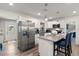 Beautiful kitchen featuring stainless steel appliances, granite countertops, and a center island with seating at 2306 Cheryl Rd, Largo, FL 33771