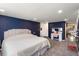 Comfortable main bedroom featuring a plush bed, makeup vanity, and adjacent sitting area for relaxation at 2306 Cheryl Rd, Largo, FL 33771