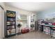 Inviting home office with organized storage, natural light from the windows, and space for creative projects at 2306 Cheryl Rd, Largo, FL 33771