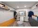 Organized walk-in closet with shelving, clothing racks, and decorative painting creating efficient storage space at 2306 Cheryl Rd, Largo, FL 33771