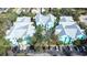 Aerial view showcasing the buildings, the parking, and mature trees of the complex at 3002 W Cleveland St # B9, Tampa, FL 33609