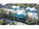 Stunning aerial view showcases complex with vibrant colors, lush trees, and paved street at 3002 W Cleveland St # B9, Tampa, FL 33609