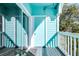 Relaxing balcony featuring comfortable seating and charming views of the neighborhood at 3002 W Cleveland St # B9, Tampa, FL 33609