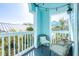 Cozy balcony offering seating and bright views of the building and surrounding tropical landscape at 3002 W Cleveland St # B9, Tampa, FL 33609