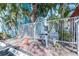 Gated entrance to a private condo complex with mature landscaping at 3002 W Cleveland St # B9, Tampa, FL 33609