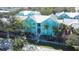 Beautiful exterior with inviting walkway, featuring eye-catching architecture and lush tropical landscaping at 3002 W Cleveland St # B9, Tampa, FL 33609