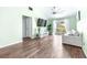 Bright living room featuring vaulted ceilings, a ceiling fan and a sliding glass door at 3002 W Cleveland St # B9, Tampa, FL 33609
