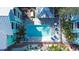 Aerial view of a refreshing pool offering a relaxing retreat and surrounded by colorful buildings at 3002 W Cleveland St # B9, Tampa, FL 33609