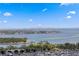 Breathtaking aerial view showcasing the bay, cityscape, and a vibrant marina filled with boats under a clear blue sky at 301 1St S St # 1601, St Petersburg, FL 33701