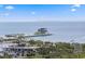 Scenic aerial view of a pier with modern buildings extending into the bay, surrounded by palm trees and a tranquil waterfront at 301 1St S St # 1601, St Petersburg, FL 33701