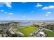 Scenic aerial view of a waterfront stadium, marina, and Tampa Bay with bright blue skies and fluffy clouds at 301 1St S St # 1601, St Petersburg, FL 33701