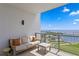 Balcony with comfortable seating and stunning views of the marina, stadium, and waterfront at 301 1St S St # 1601, St Petersburg, FL 33701