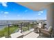 Spacious balcony with chairs and panoramic views of the bay, stadium, and city skyline at 301 1St S St # 1601, St Petersburg, FL 33701