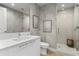 Contemporary bathroom features a glass shower, modern vanity and stylish wallpaper at 301 1St S St # 1601, St Petersburg, FL 33701
