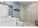 Modern bathroom with a glass shower, floating shelf and contemporary fixtures at 301 1St S St # 1601, St Petersburg, FL 33701