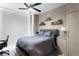 Comfortable bedroom features a ceiling fan, shelves, and bedside table, creating a cozy retreat at 301 1St S St # 1601, St Petersburg, FL 33701
