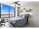 Bedroom with large window and ceiling fan; showcases city views at 301 1St S St # 1601, St Petersburg, FL 33701
