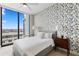 Cozy bedroom with a large window, ceiling fan and botanical wallpaper at 301 1St S St # 1601, St Petersburg, FL 33701