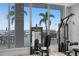 Modern gym equipment with views of the coast from the large window at 301 1St S St # 1601, St Petersburg, FL 33701