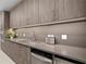 Sleek kitchen with modern cabinets, stainless steel appliances, under-cabinet lighting, and a stainless steel sink at 301 1St S St # 1601, St Petersburg, FL 33701