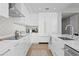 Bright, white modern kitchen with stainless steel appliances, ample counter space and cabinetry at 301 1St S St # 1601, St Petersburg, FL 33701