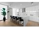 Modern kitchen with an island, white cabinets, stainless steel appliances, and bar stool seating at 301 1St S St # 1601, St Petersburg, FL 33701