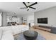 Open-concept living room with modern decor, showcasing a large sectional sofa and views of the modern kitchen at 301 1St S St # 1601, St Petersburg, FL 33701