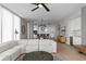 Open-concept living area featuring a white sectional sofa, modern lighting, and an adjacent kitchen at 301 1St S St # 1601, St Petersburg, FL 33701