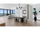Bright, open-concept living space with modern furnishings, dining area, and floor-to-ceiling windows at 301 1St S St # 1601, St Petersburg, FL 33701
