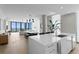 Open-concept living area featuring modern kitchen, dining space, and panoramic water views at 301 1St S St # 1601, St Petersburg, FL 33701