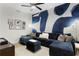 Inviting living room with a plush sectional sofa and bold accent wall, perfect for relaxation at 301 1St S St # 1601, St Petersburg, FL 33701