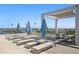 Enjoy the beautiful view from this rooftop lounge deck featuring cushioned lounge chairs and table seating at 301 1St S St # 1601, St Petersburg, FL 33701