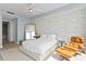 Bright bedroom boasts a comfortable king bed, reading chair, and great views of the water and cityscape at 301 1St S St # 1601, St Petersburg, FL 33701