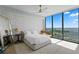 Serene bedroom features a large window, a king bed, and a stunning view of the marina at 301 1St S St # 1601, St Petersburg, FL 33701