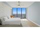 Bright main bedroom with a king bed, floor to ceiling windows, and stunning view of the harbor at 301 1St S St # 1601, St Petersburg, FL 33701