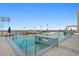 Luxury rooftop pool deck featuring clear blue water, stylish lounge chairs, and scenic marina views for upscale relaxation at 301 1St S St # 1601, St Petersburg, FL 33701
