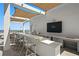 Stylish outdoor kitchen on a terrace featuring a built-in grill, wet bar, and covered seating area with stunning water views at 301 1St S St # 1601, St Petersburg, FL 33701