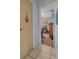 Hallway view showcasing a bedroom with good natural light at 3106 E Diana St, Tampa, FL 33610